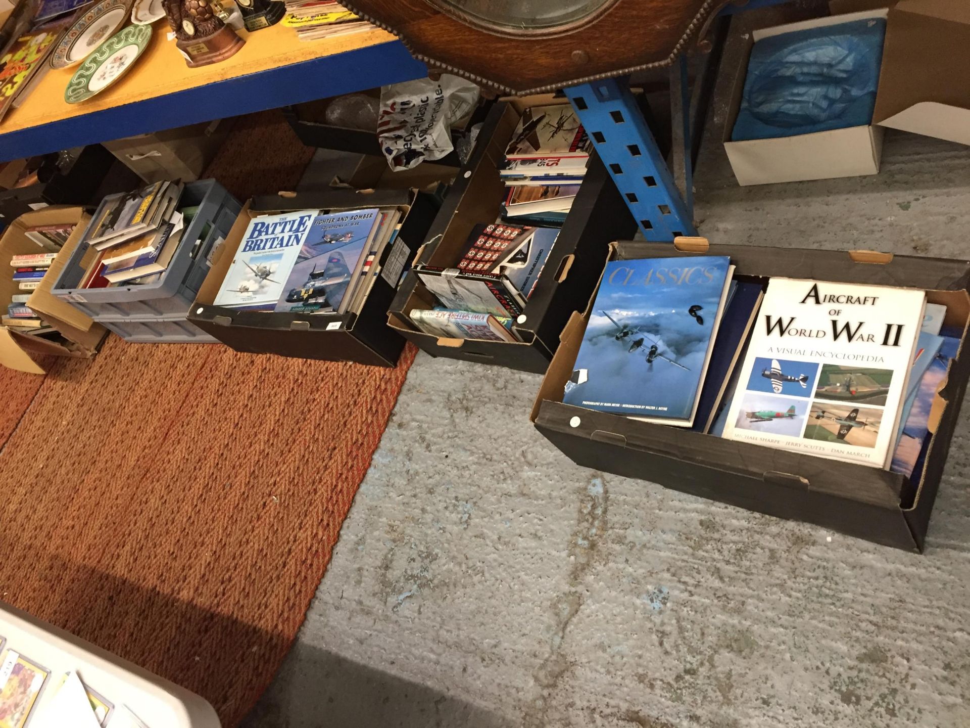 FIVE BOXES OF BOOKS ABOUT MILITARY PLANES AND PILOTS
