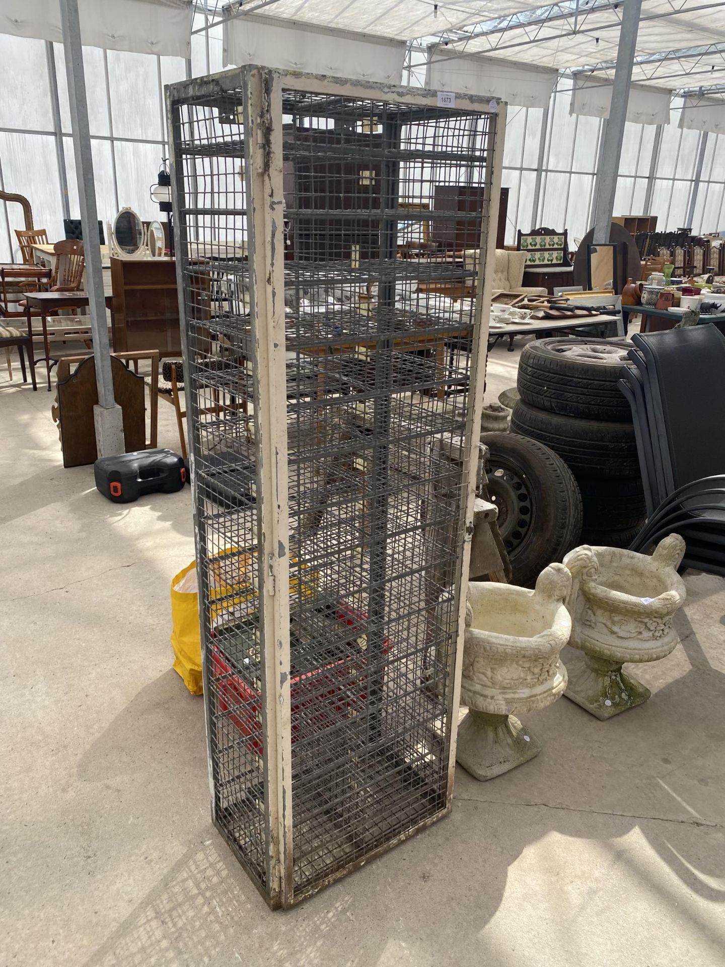 A VINTAGE GALVANISED LOCKABLE 32 SECTION PIGEON HOLE UNIT