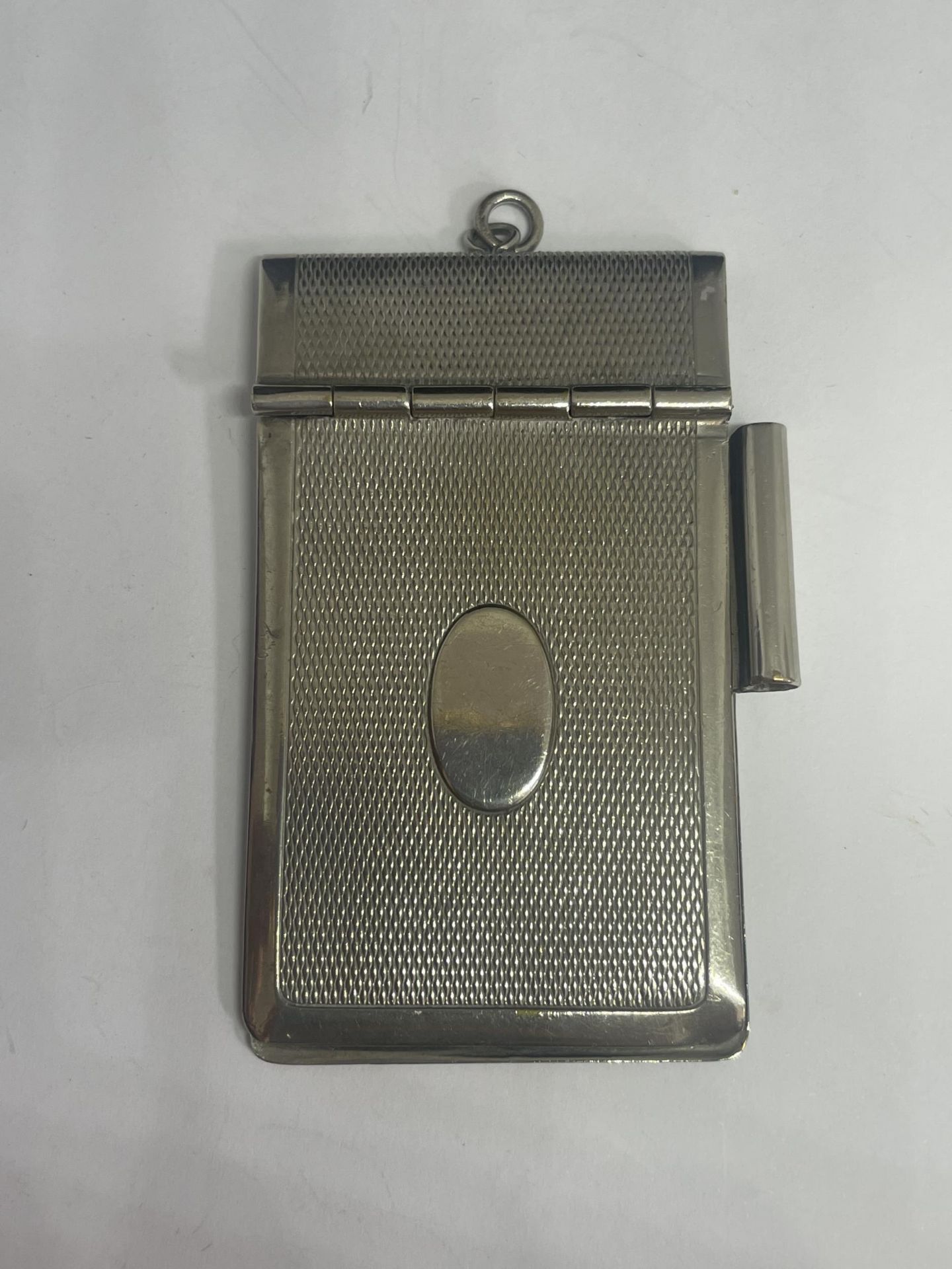 A WHITE METAL CARD CASE WITH PENCIL HOLDER