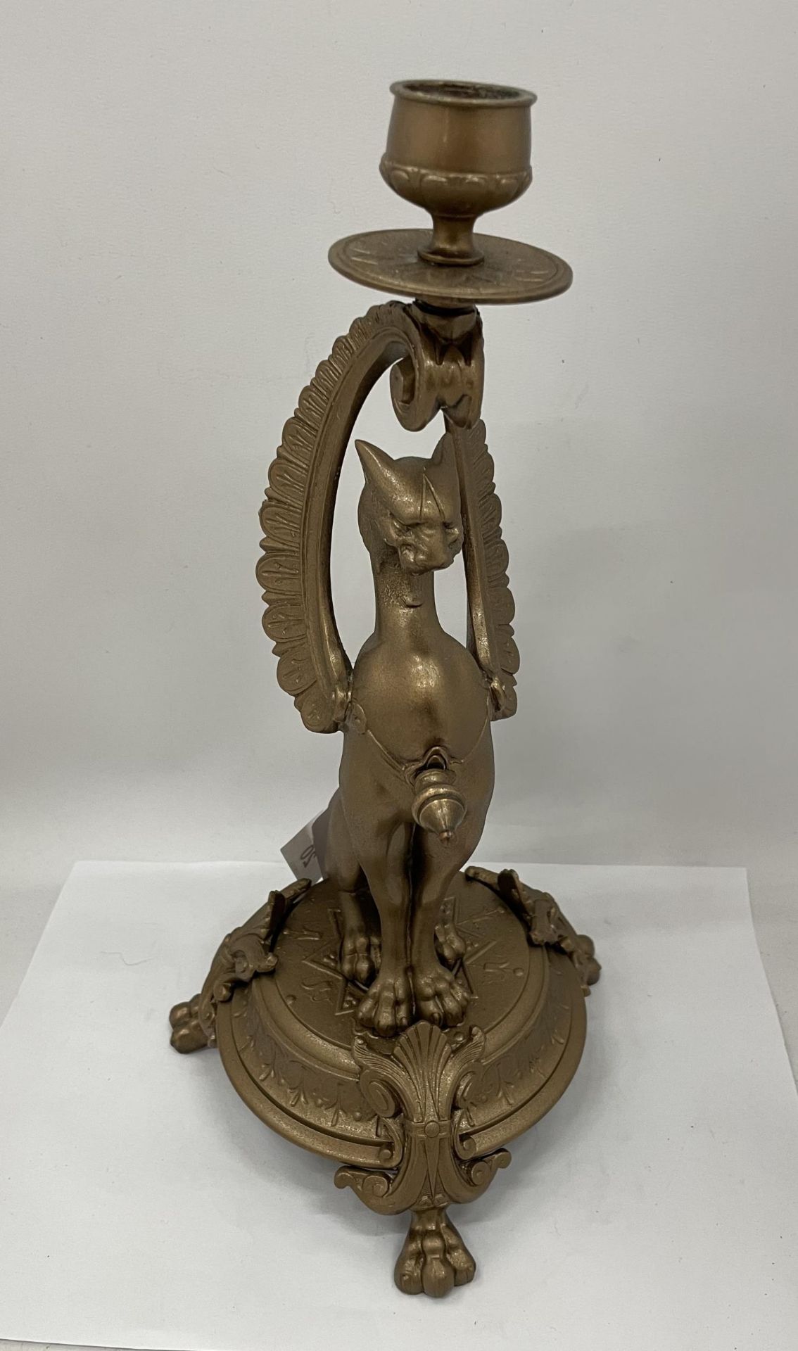 A VINTAGE BRASS SPHINX CAT CANDLESTICK, HEIGHT 34CM