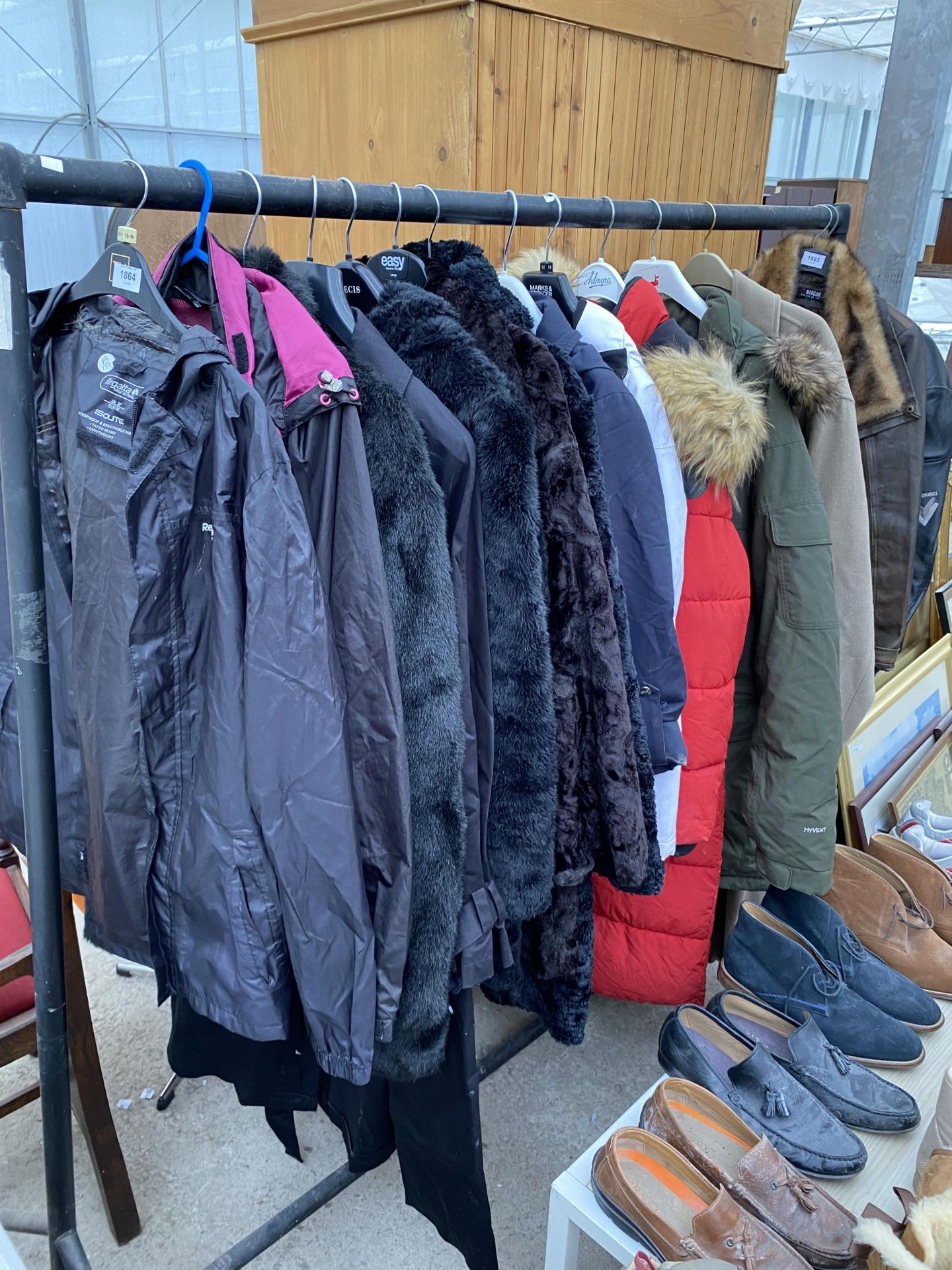 A LARGE ASSORTMENT OF COATS AND JACKETS