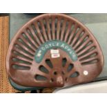 A CAST METAL WM DOYLE & CO LTD IMPLEMENT / TRACTOR SEAT
