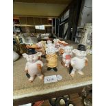 A COLLECTION OF CERAMIC 'PIGGIES' PIG FIGURES