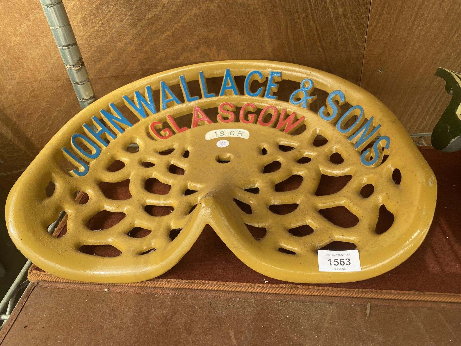 A VINTAGE PAINTED 'JOHN WALLACE & SONS' IMPLEMENT SEAT