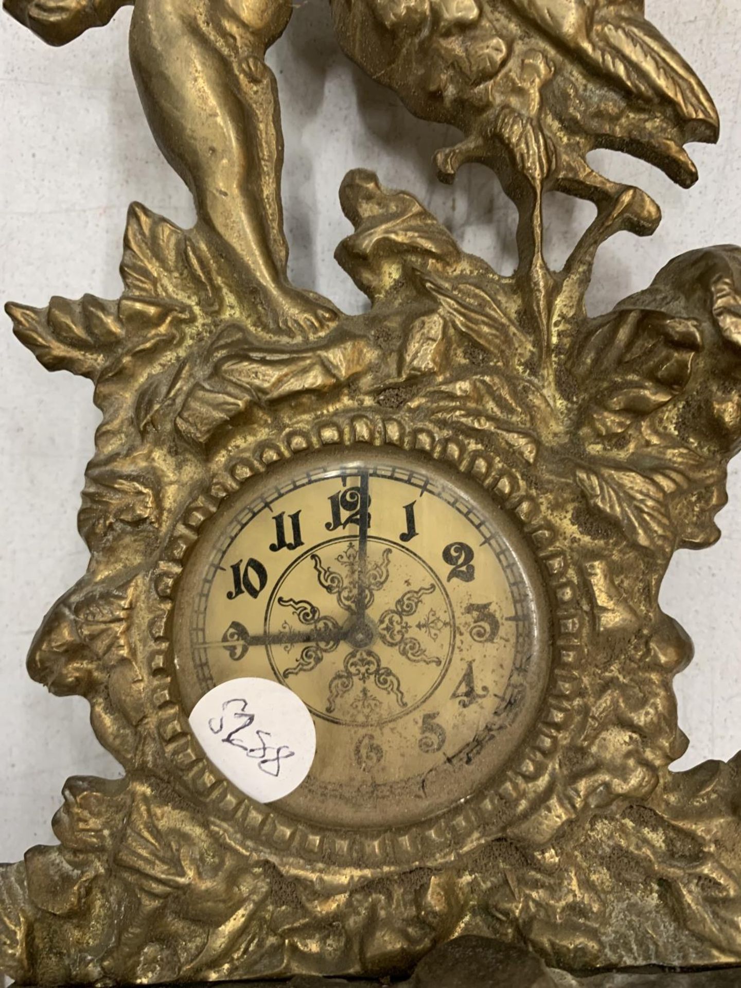 A VINTAGE BRASS ALARM CLOCK WITH ORNATE CHERUB AND STORK DETAIL PLUS A WHITE METAL TRINKET BOX - Image 3 of 6