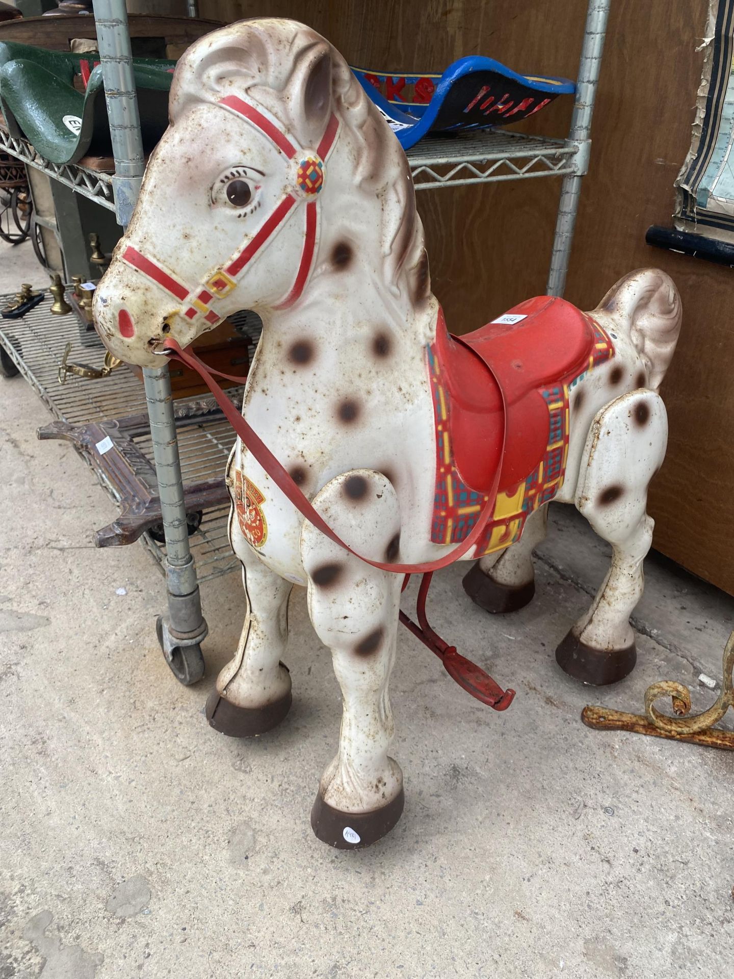 A VINTAGE TIN RIDE ALONG CHILDS HORSE