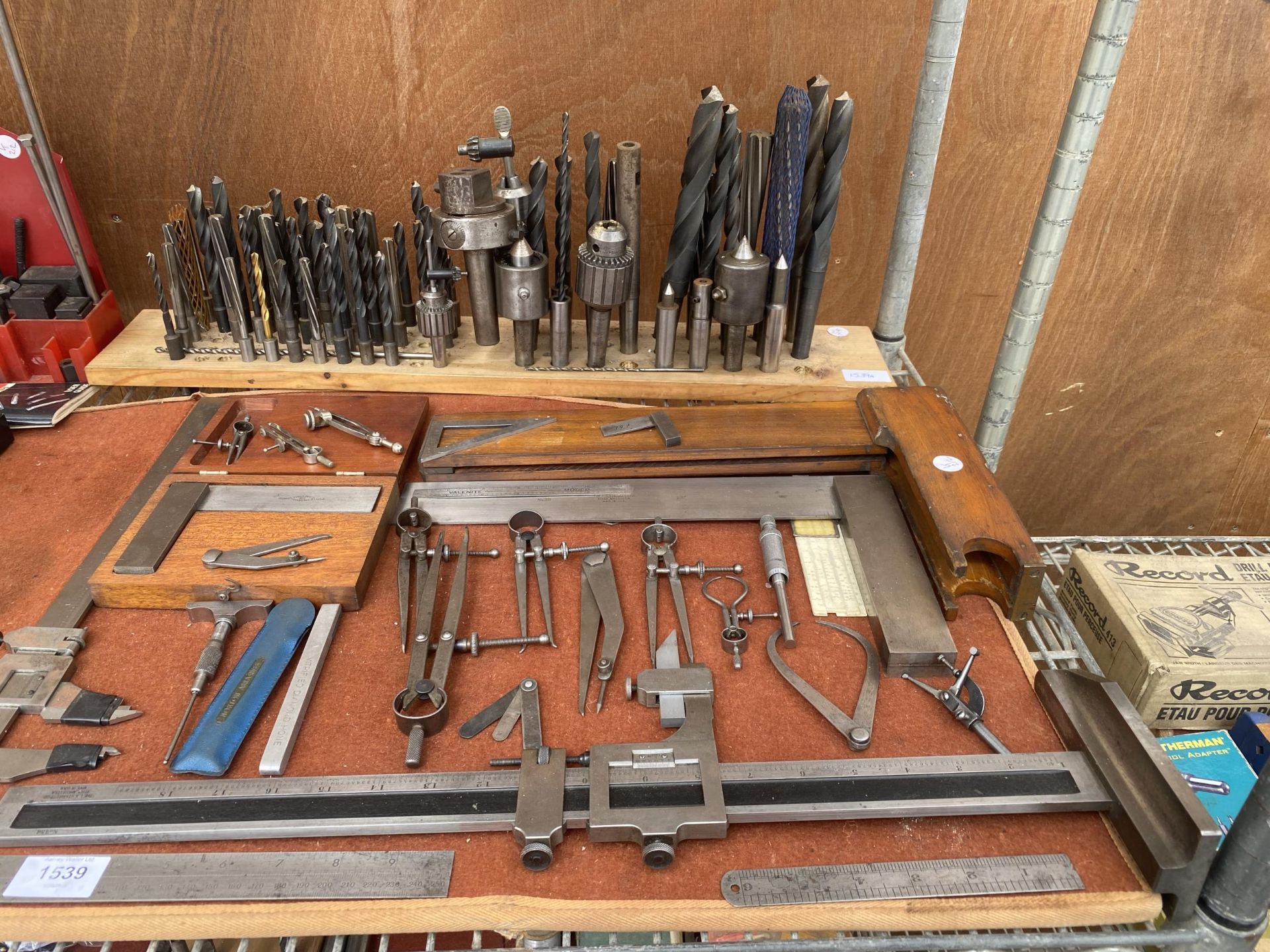AN ASSORTMENT OF ENGINEERS TOOLS TO INCLUDE CALIPERS AND SET SQUARES ETC