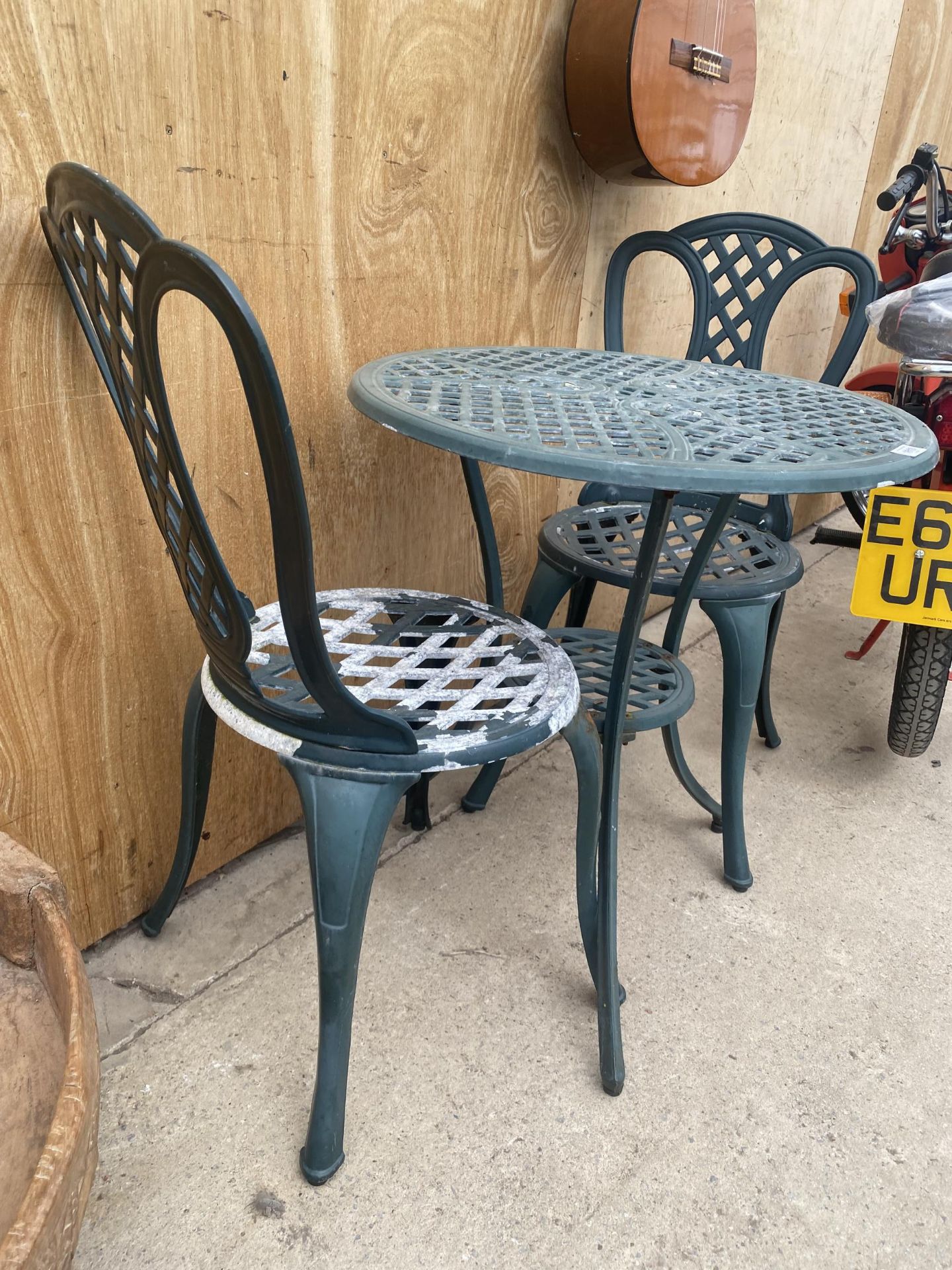 A CAST ALLOY BISTRO SET COMPRISING OF A ROUND TABLE AND TWO CHAIRS - Image 2 of 2