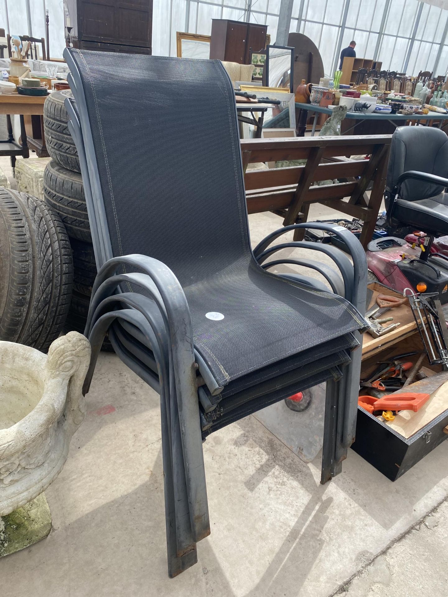 FOUR METAL STACKING GARDEN CHAIRS