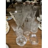 A QUANTITY OF GLASSWARE TO INCLUDE CUT GLASS VASES, LIDDED POTS, A SWEDISH TEALIGHT HOLDER, OWL