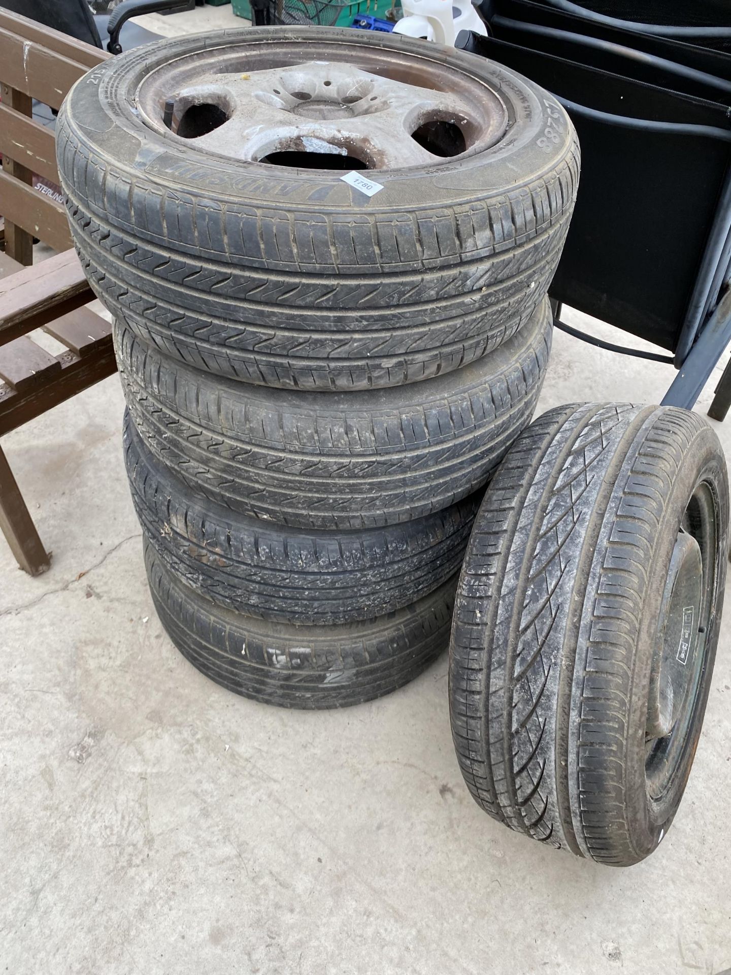 A SET OF FOUR MERCEDES-BENZ RIMS WITH 215/55ZR16 TYRES AND A FURTHER SPARE WHEEL