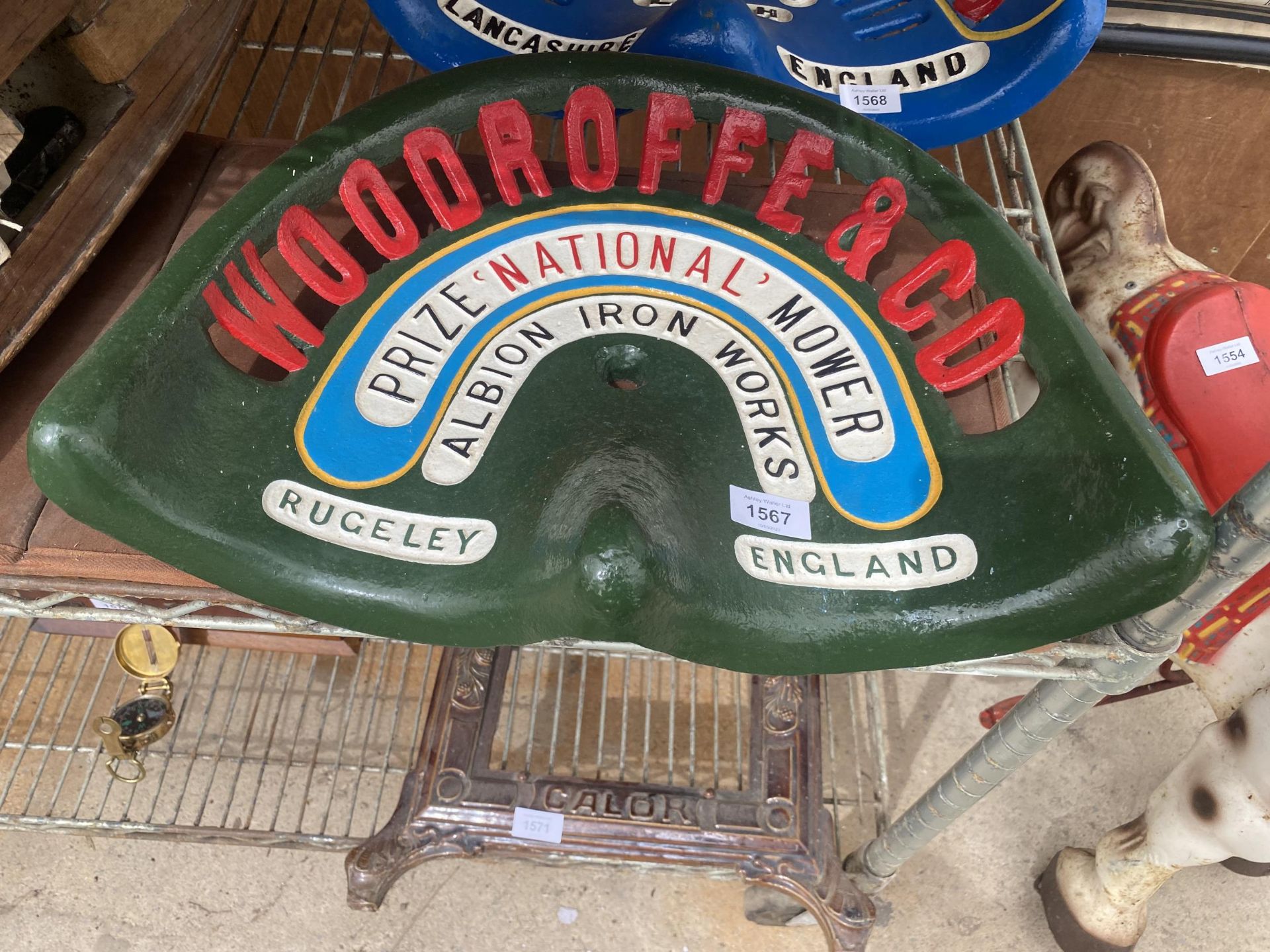 A VINTAGE 'WOODROFFE & CO' PAINTED IMPLEMENT SEAT