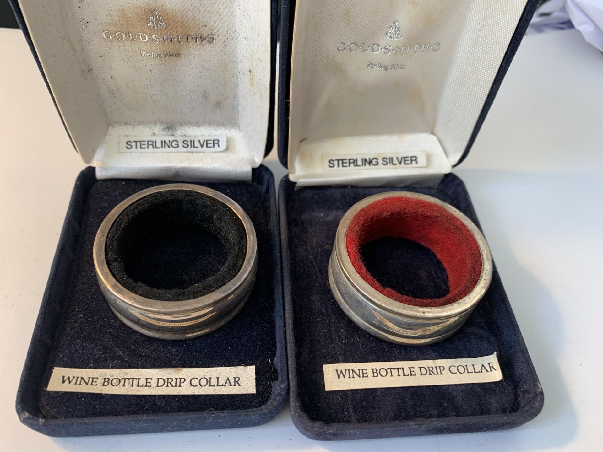 TWO BOXED SILVER WINE BOTTLE DRIP COLLARS ONE HALLMARKED SHEFFIELD AND ONE BIRMINGHAM