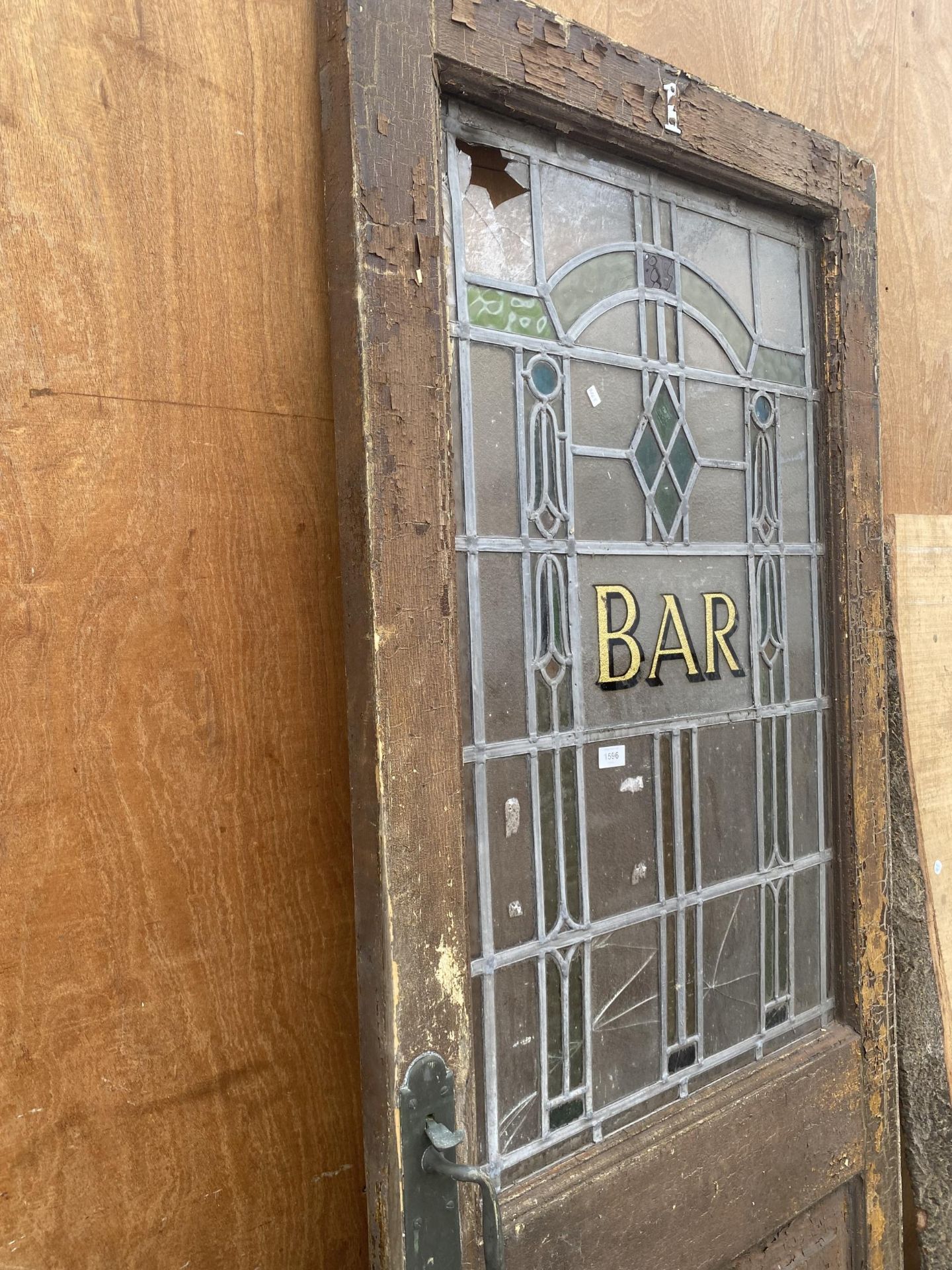 A VINTAGE WOODEN 'BAR' DOOR WITH GLAZED AND LEADED UPPER PORTION - Image 2 of 3