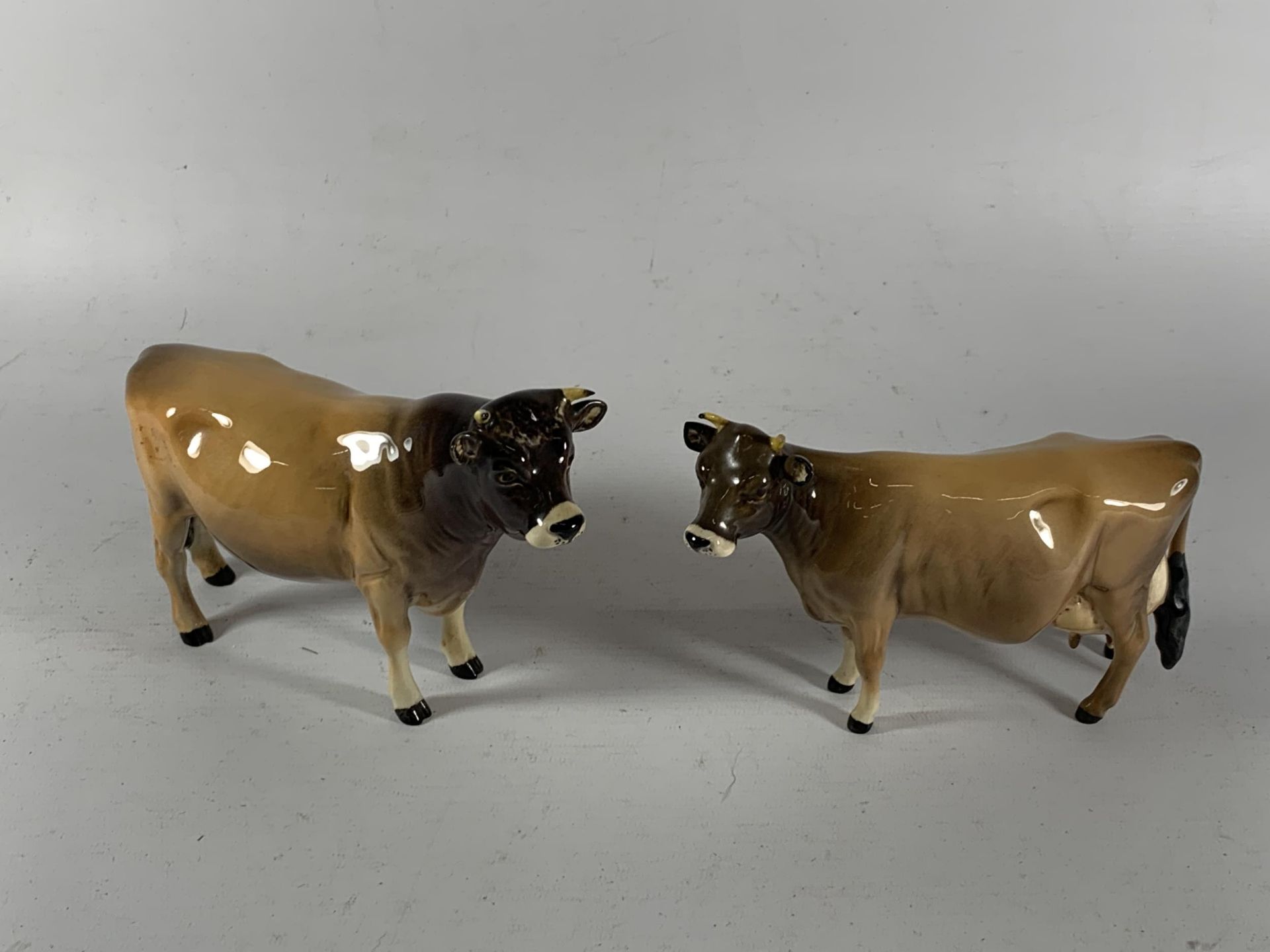 TWO BESWICK COW CATTLE ANIMAL FIGURES TO INCLUDE DUNSLEY COYBOY