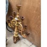 A VINTAGE SIX BRANCH CAST IRON CANDELABRA