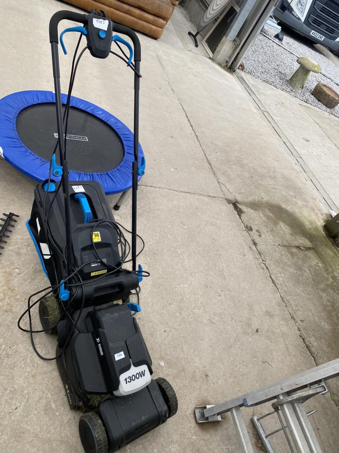 A MACALLISTER 1300W ELECTRIC LAWN MOWER WITH GRASS BOX