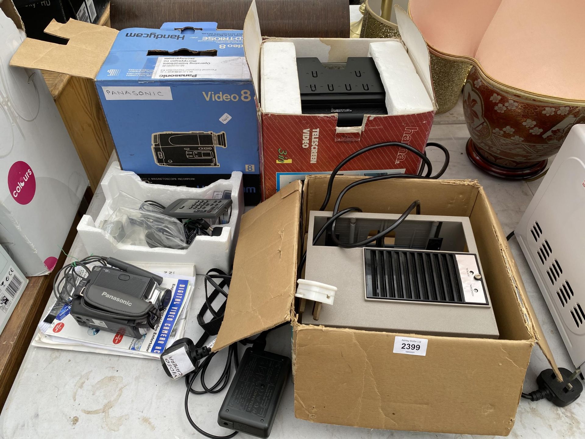 AN ASSORTMENT OF ITEMS TO INCLUDE A PROJECTOR AND CAMCORDERS ETC