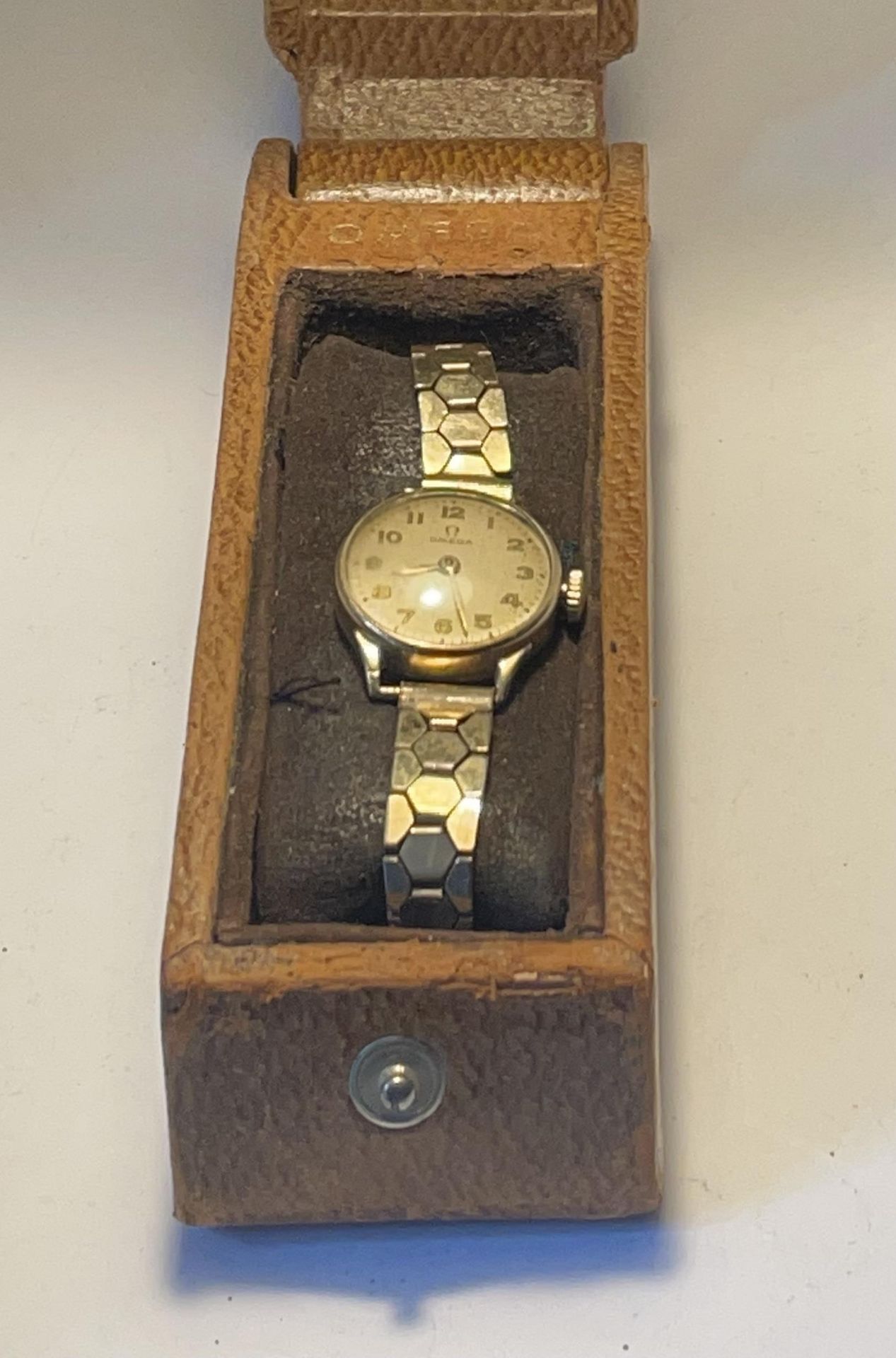 A LADIES OMEGA 9 CARAT GOLD WRIST WATCH WITH ROLLED GOLD STRAP IN ORIGINAL OMEGA CASE SEEN WORKING