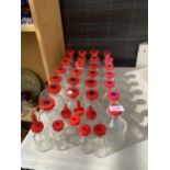 AN ASSORTMENT OF CHEMISTRY BOTTLES WITH STOPPERS