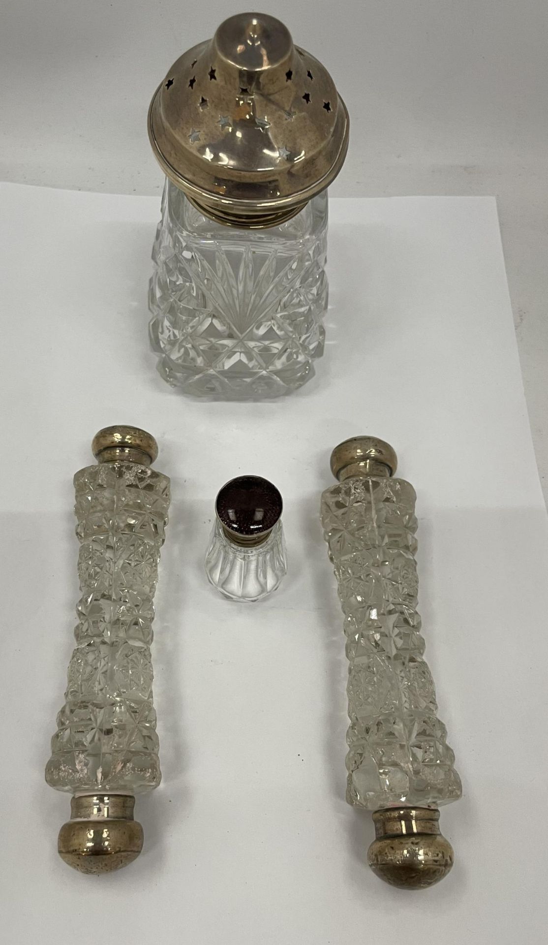 A COLLECTION OF CUT GLASS AND HALLMARKED SILVER ITEMS - SUGAR SIFTER, POT AND PAIR OF DOUBLE ENDED