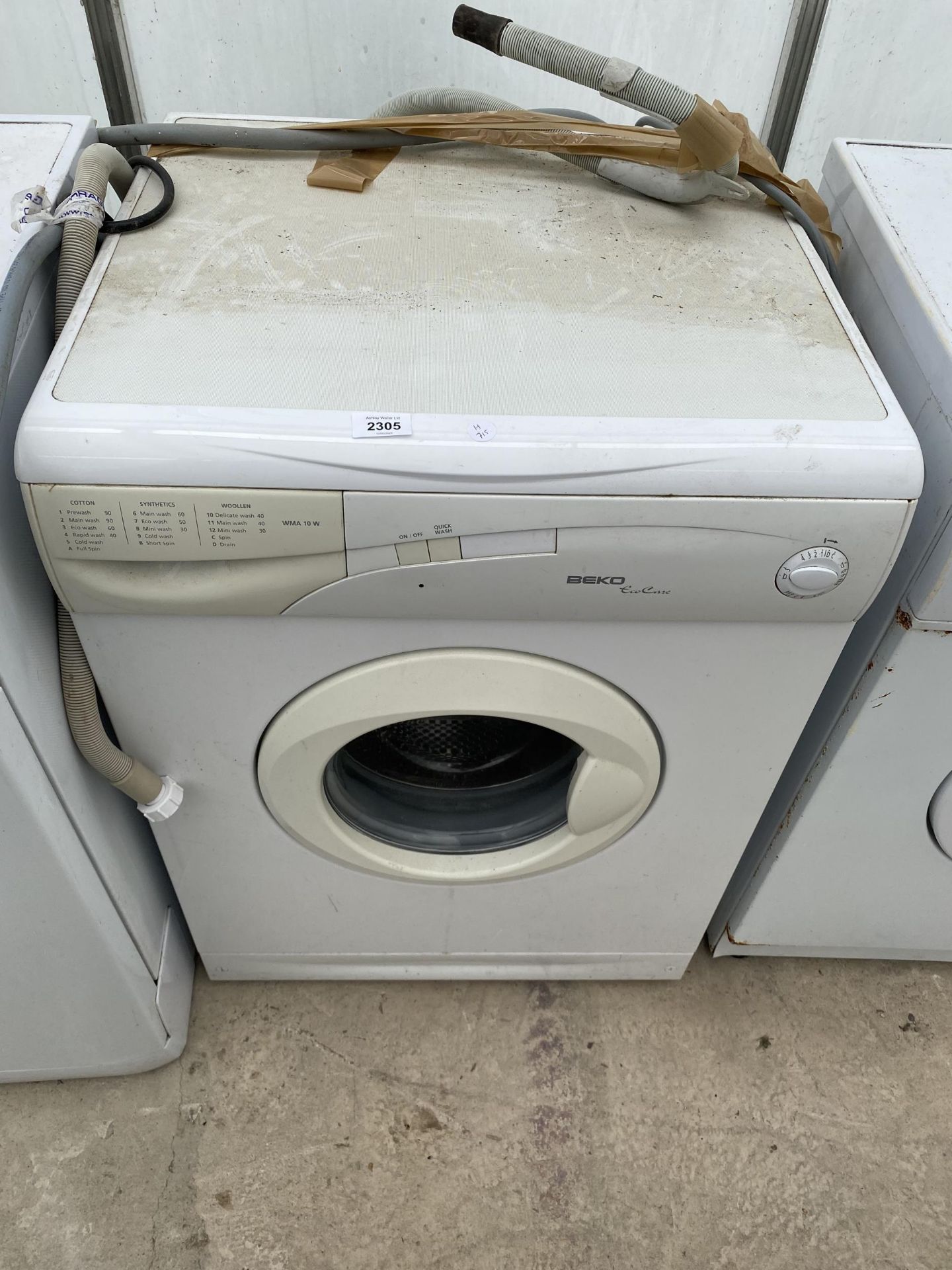 A WHITE BEKO WASHING MACHINE