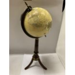 A WORLD GLOBE ON WOODEN BASE