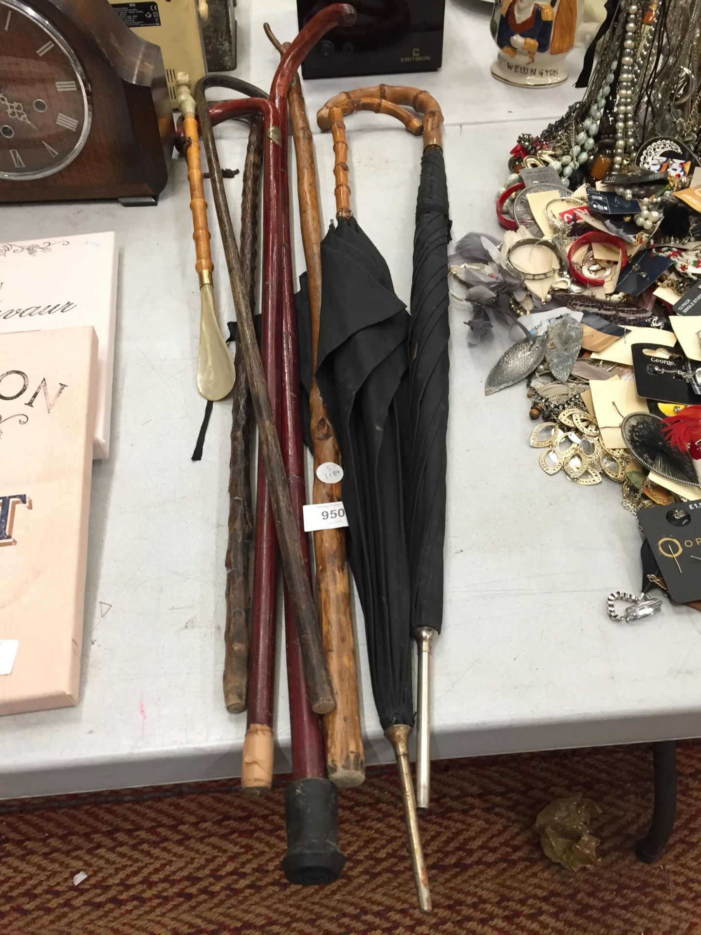 A COLLECTION OF VINTAGE WALKING STICKS, TWO UMBRELLAS ETC