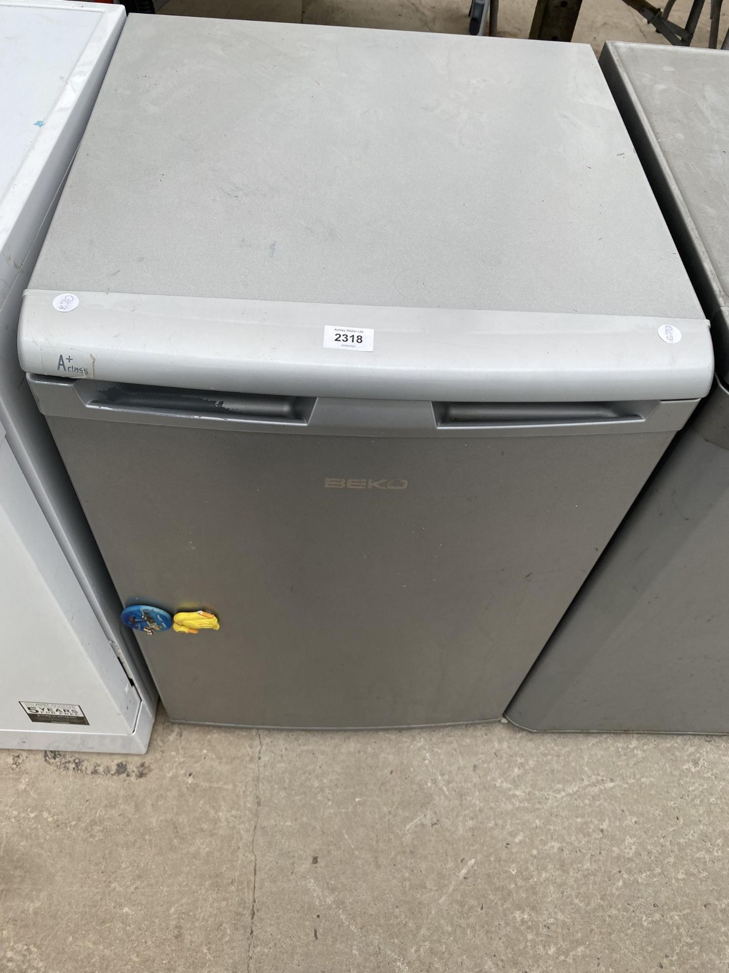 A SILVER BEKO UNDERCOUNTER FRIDGE