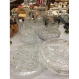 A LARGE QUANTITY OF CUT GLASSWARE TO INCLUDE VASES, BOWLS, A DECANTER, JUG, ETC