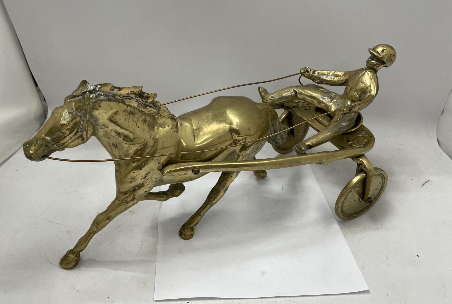 A VINTAGE BRASS MODEL OF A HORSE AND RIDER, LENGTH 37CM