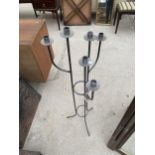 A TALL METAL SIX BRANCH CANDLE HOLDER