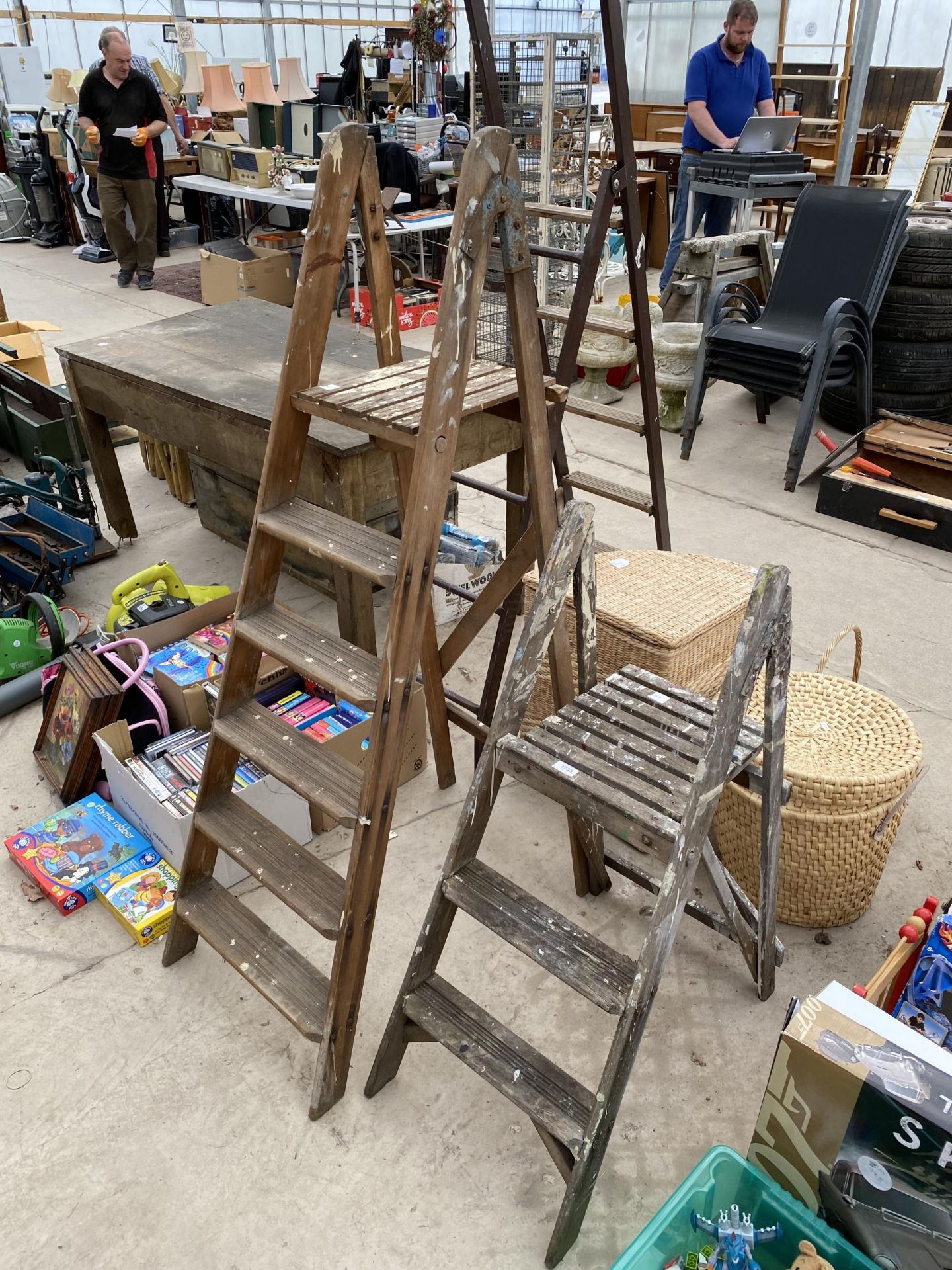 TWO VINTAGE WOODEN STEP LADDERS TO INCLUDE A FIVE RUNG AND A TWO RUNG