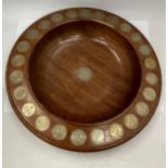 A VINTAGE WOODEN BOWL INSET WITH OLD SHILLINGS