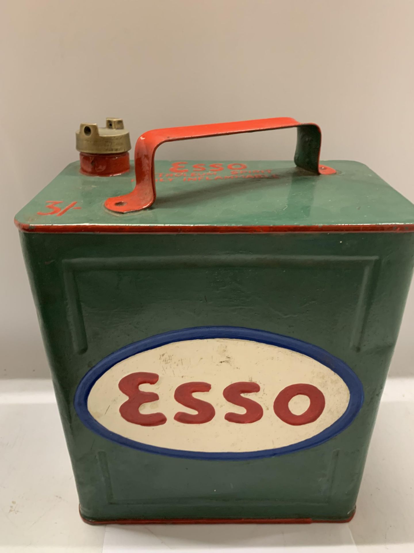 A VINTAGE ESSO PETROL CAN WITH BRASS TOP