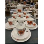 A WEDGWOOD COFFEE SET IN THE SUSIE COOPER POPPY DESIGN TO INCLUDE A COFFEE POT, CREAM JUG, SUGAR