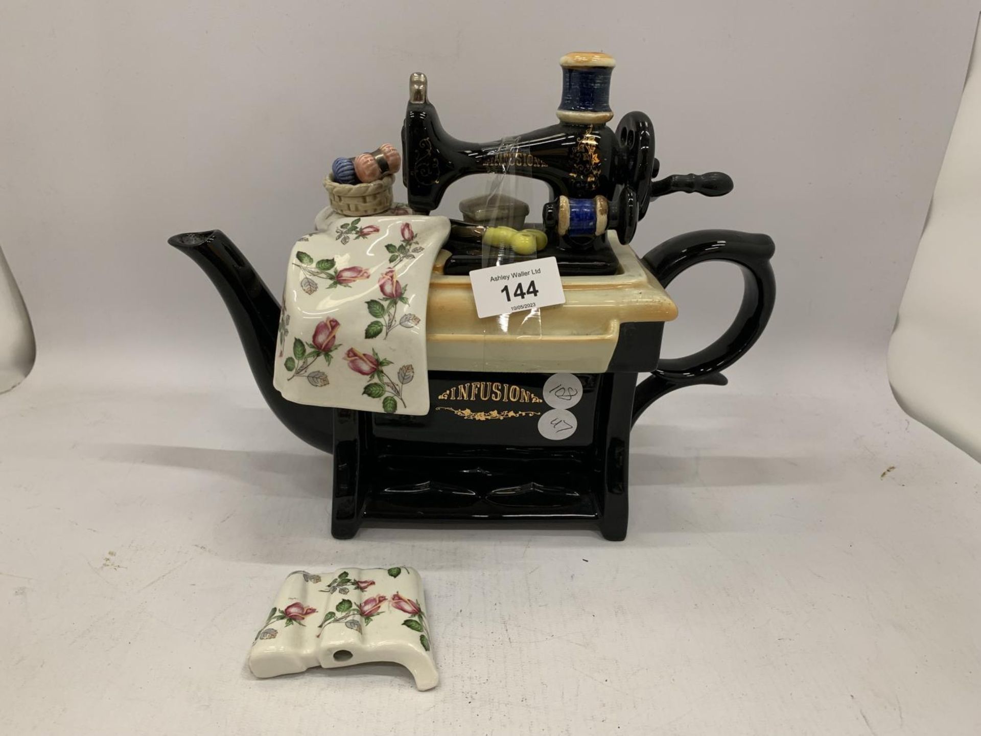 A TEAPOT IN THE GUISE OF A SEWING MACHINE - A/F