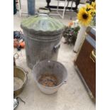 A GALVANISED DUSTBIN WITH LID AND A GALVANISED BUCKET