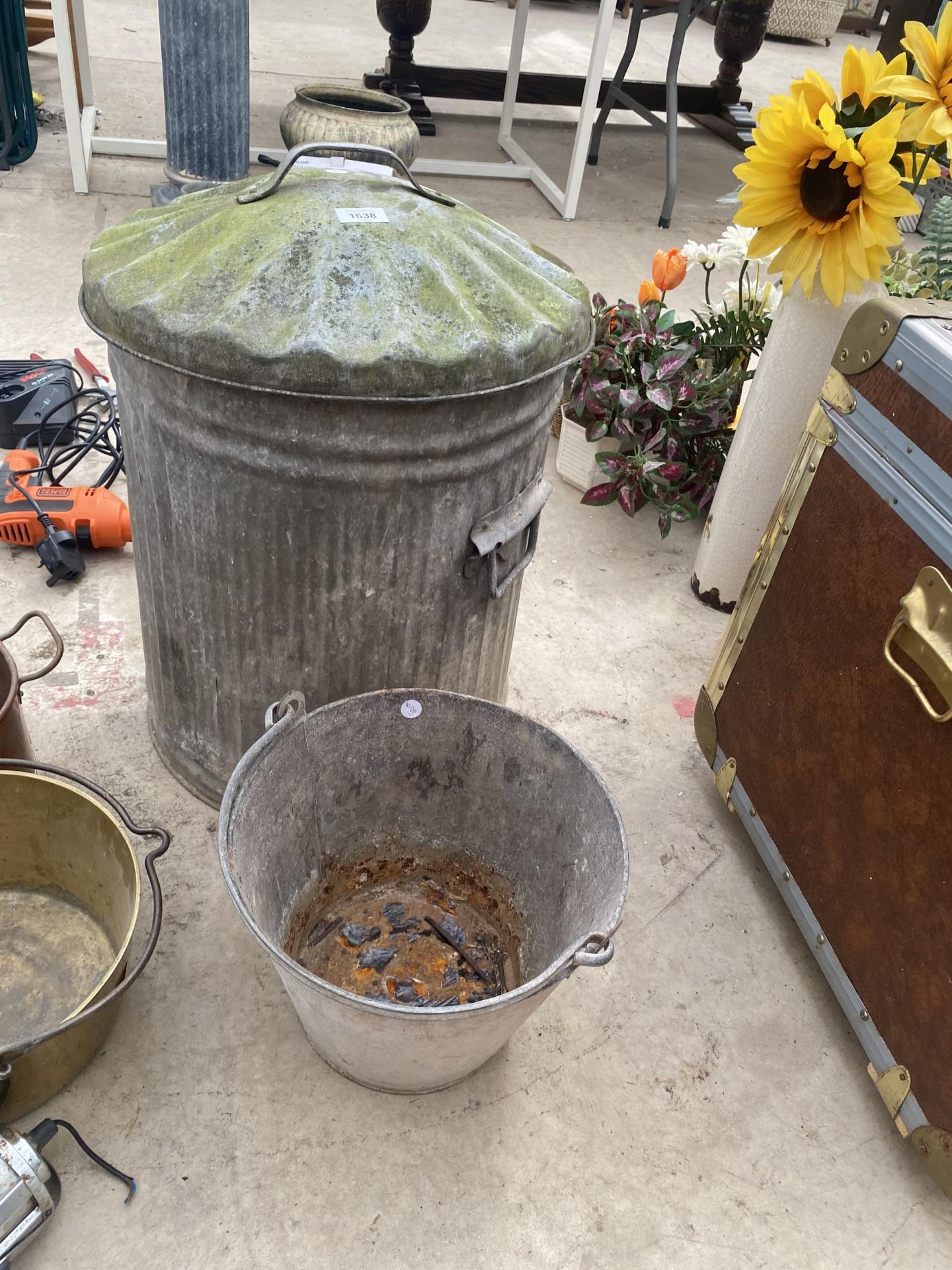 A GALVANISED DUSTBIN WITH LID AND A GALVANISED BUCKET