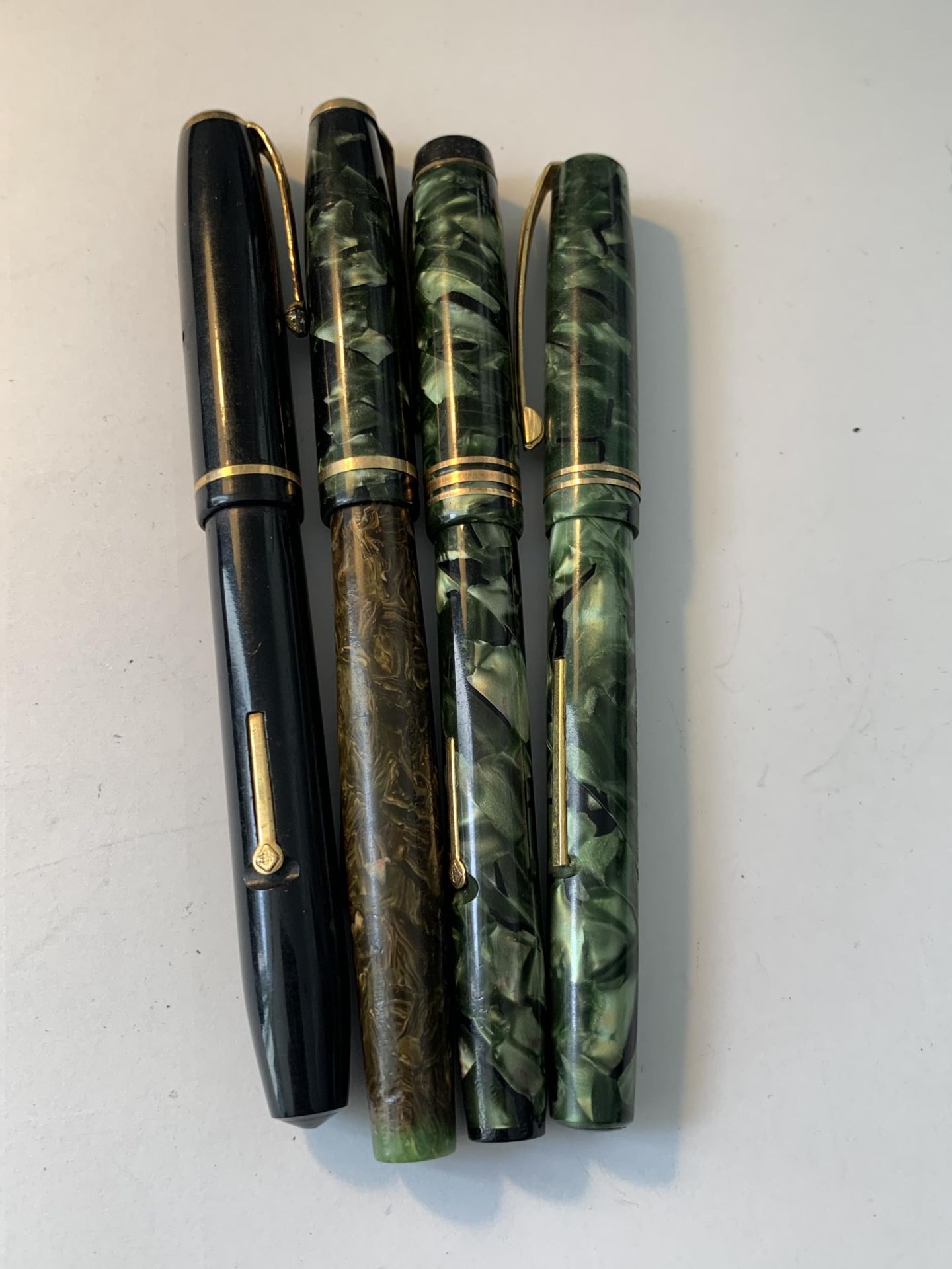 FOUR CONWAY FOUNTAIN PENS