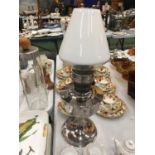 A VINTAGE STAINLESS STEEL EFFECT OIL LAMP