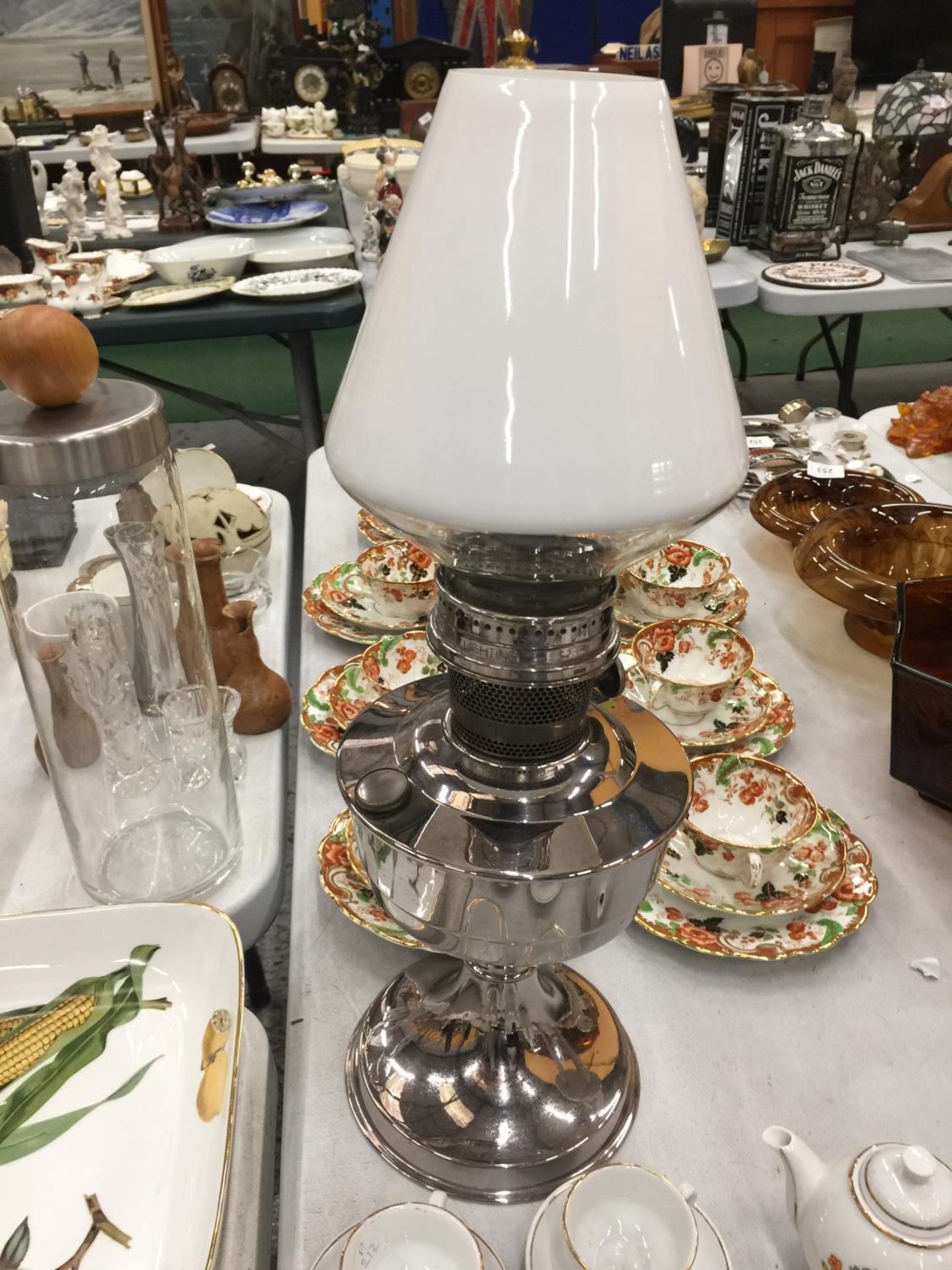 A VINTAGE STAINLESS STEEL EFFECT OIL LAMP