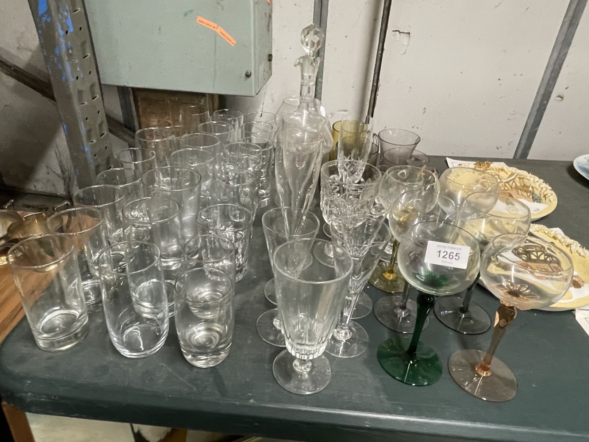 A QUANTITY OF GLASSES TO INCLUDE WINE, A DECANTER, CHAMPAGNE FLUTES, SHERRY, TUMBLERS, ETC