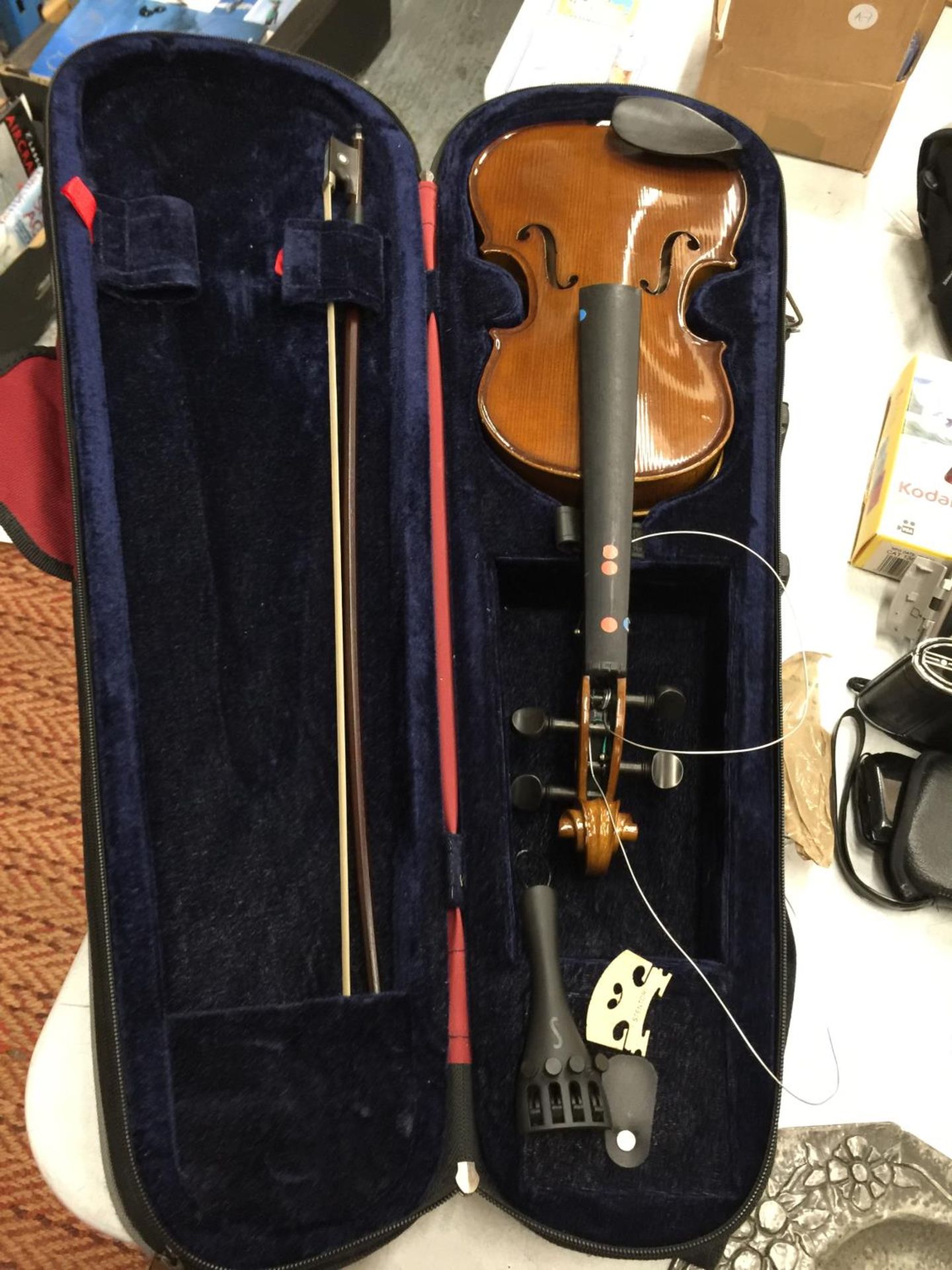 A CASED VIOLIN AND BOW