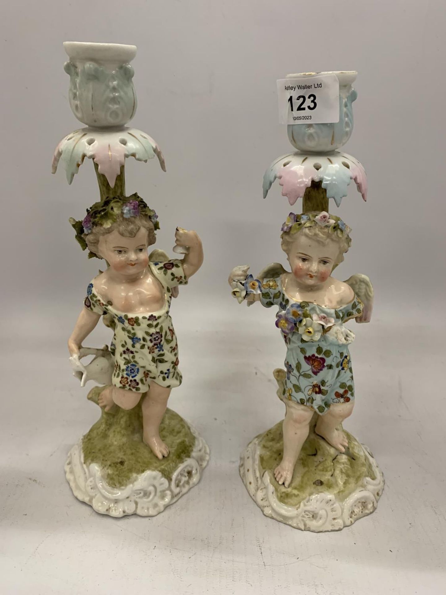 A PAIR OF 19TH CENTURY DRESDEN STYLE CONTINENTAL HARD PASTE PORCELAIN FIGURAL CANDLE HOLDERS WITH