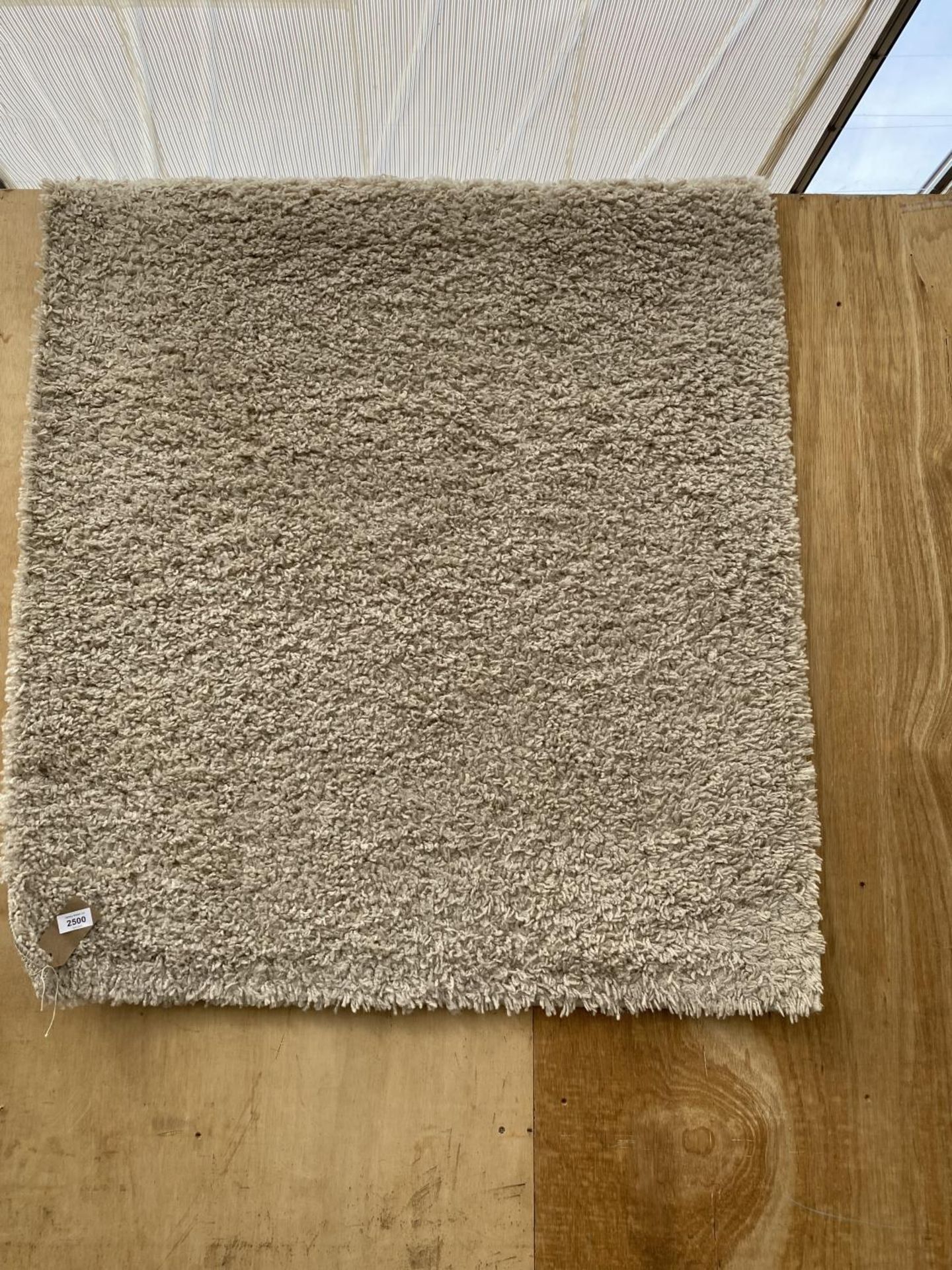 A MODERN CREAM RUG