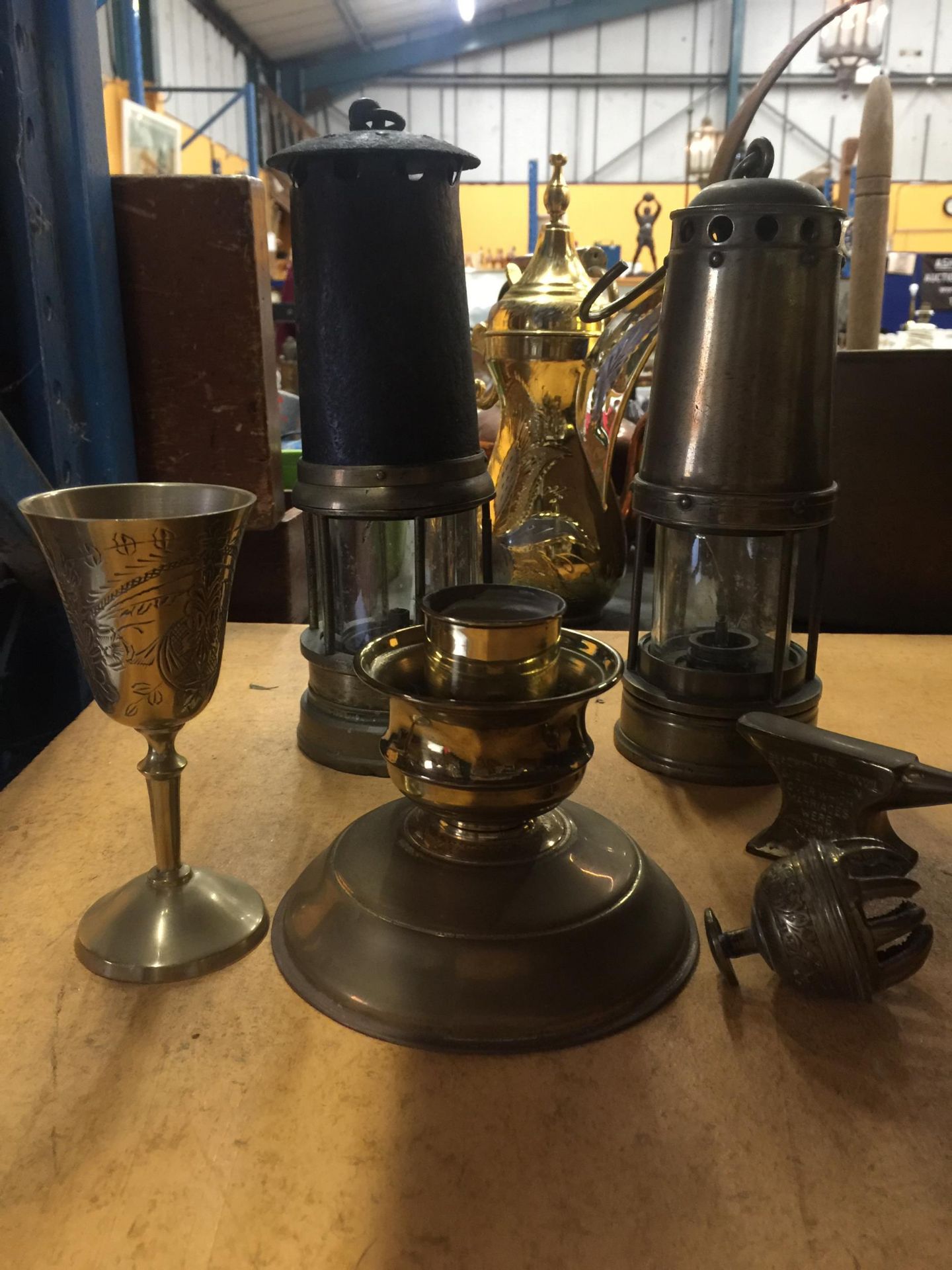 TWO VINTAGE MINERS LAMPS, A BRASS CANDLESTICK, SMALL ANVIL, ASIAN PRAYER BELL, ETC