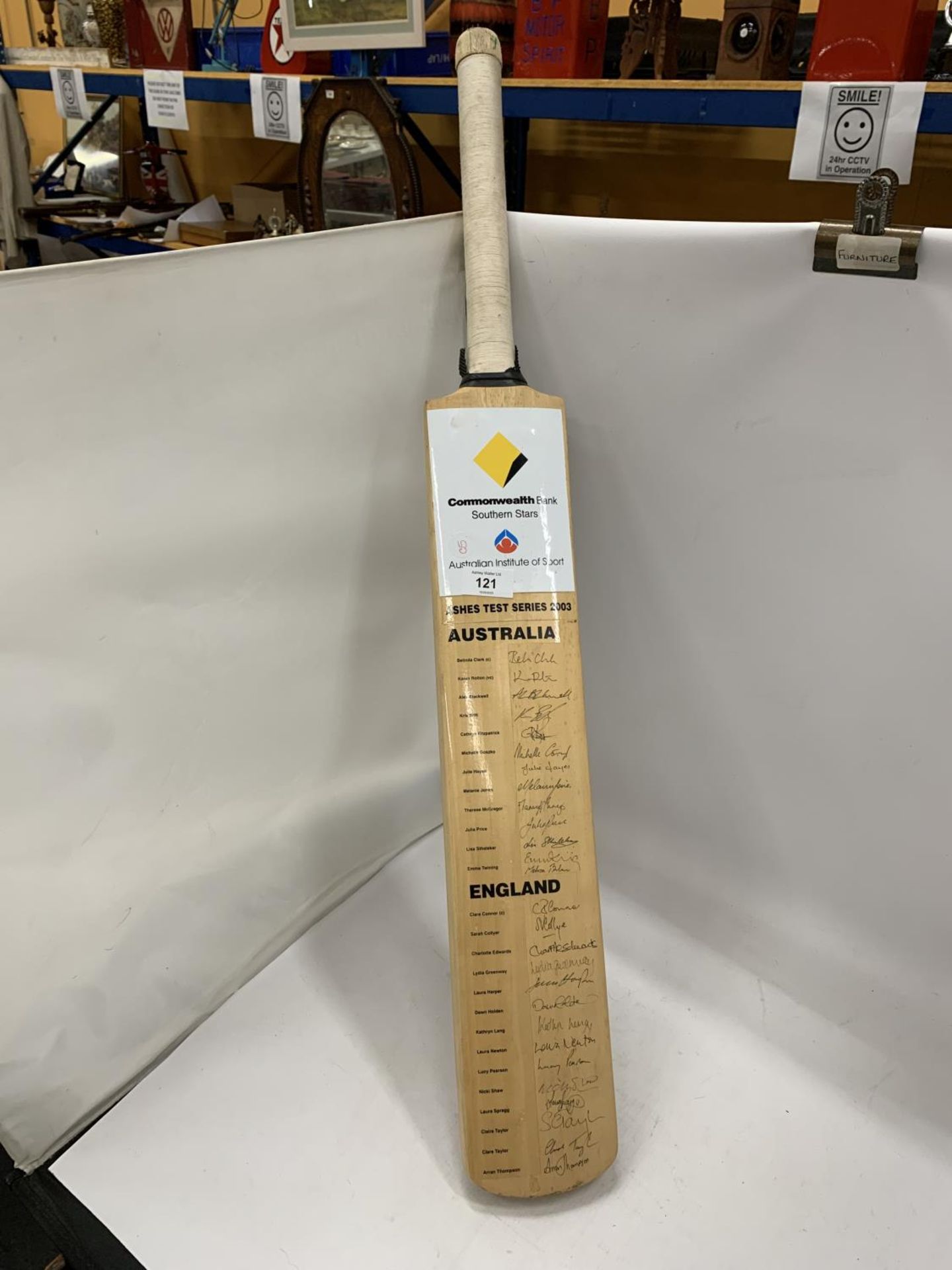 A RARE 2003 LADIES ASHES SERIES BAT, SIGNED BY BOTH TEAMS