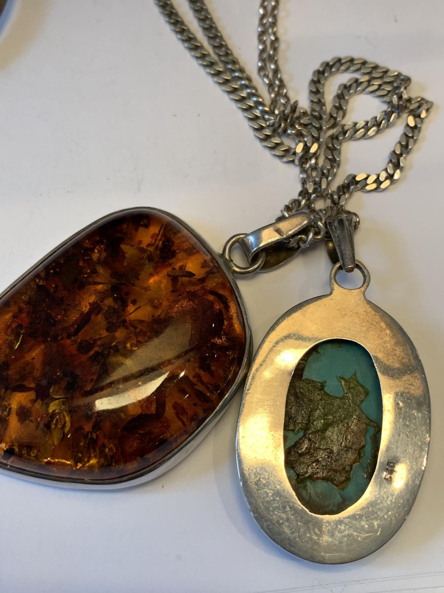 TWO SILVER NECKLACES WITH LARGE PENDANTS AND A SILVER BANGLE - Image 3 of 4