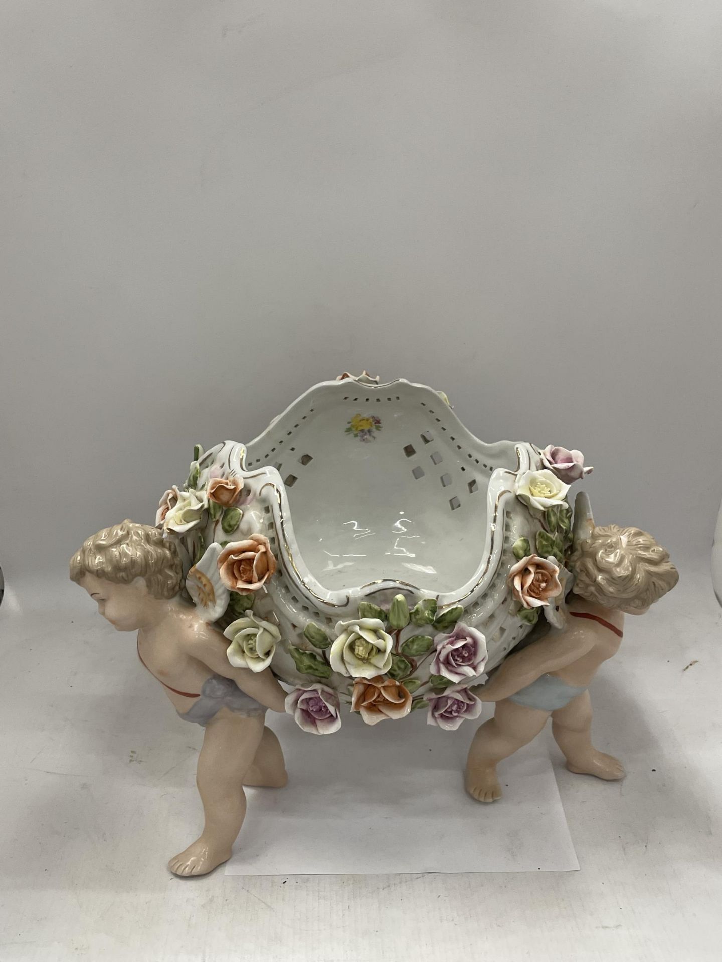 A CONTINENTAL PORCELAIN CHERUB DESIGN FLORAL ENCRUSTED BOWL WITH MEISSEN BLUE CROSS SWORDS MARK TO - Image 2 of 6